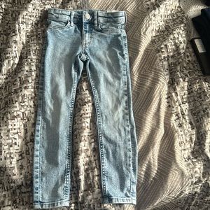 H & M light blue skinny leg toddler jeans with light white stitching
